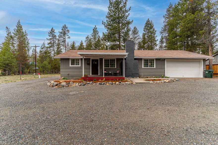 This is a charmer, live the simple country lifestyle! Complete interior remodel in 2016, lives like a new home w/new vinyl windows, doors, deck & fresh exterior paint. Upgrades include prefinished hardwoods throughout, tile entry, blinds, electric heat pump & AC + a tankless water heater. The open floor plan is a perfect gathering space. Great room has a gas fireplace & dining area. New stainless steel appliances, solid surface counters, a farmhouse sink & new cabinetry along w/center island upgrades in kitchen. The bathroom is new w/laminate floors, double vanity, toilet & a new shower/tub surround. Convenient large utility room w/a sink & a folding table. A 24 x 36 pole barn constructed in 2021 makes a perfect workshop, RV or toy garage. The backyard is beautifully fenced w/open wire fencing to allow a view of the forested acre.  A chicken coop provides fresh eggs every day! The outdoor greenhouse is a perfect place for flowers, vegetable starts and tomatoes. Love where you live!