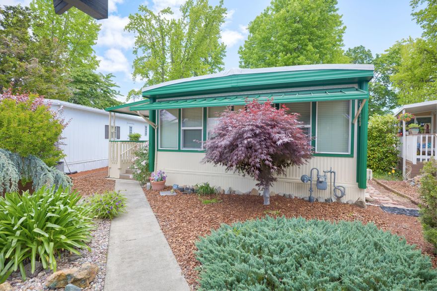 BRAND NEW 20 YEAR ROOF!! BRING ALL OFFERS! SELLER IS MOTIVATED AND NEEDS THIS SOLD! This two bedroom, two bathroom, 1000 SqFt cutie has been professionally cleaned and is move-in ready. With a spacious living with big, bright, updated windows, it has just the right amount of natural light. This home has been well cared for with updated mini split system and exterior paint. The lot is fully fenced with beautiful flowers and landscaping. 
Roguelea Estates is Grants Pass' premier 55+ manufactured home community sitting right along the mighty Rogue River. Living in this community you will have access to a private park along the river where you can watch the famous jet boat races, enjoy river wildlife, and have picnics with your friends and family. The beautiful lake offers trout and bass catch and release fishing. The Clubhouse offers a variety of activities and can be reserved for private parties. The park does allow pets. All applicants must be approved by park management.