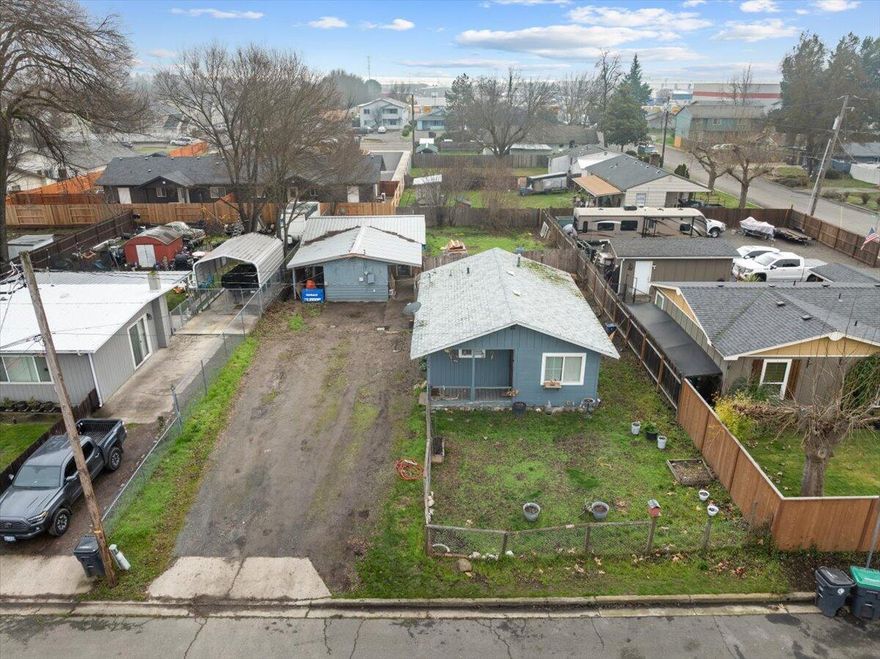 Discover value with this unique property featuring a move-in ready 600 sq ft one-bedroom home PLUS a 768 sq ft framed structure currently used for storage but with incredible potential to become an ADU (Accessory Dwelling Unit) or shop space. Large 0.19 lot has space to park multiple RV's or vehicles, plus off street parking.

Nestled on a tucked away street in a central Medford neighborhood, this versatile property offers endless possibilities for savvy investors and entrepreneurs. Live in the main residence while developing the second structure, and maximize your large lot and finish out the shop or man-cave/she-shed of your dreams. Sold as is. Owner Carry Terms Available.