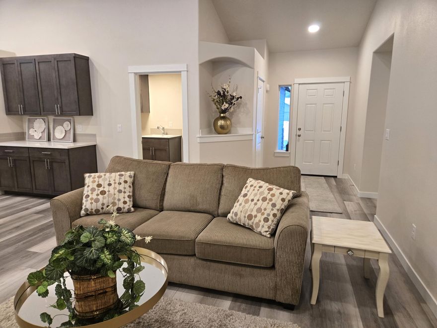 New Construction- Recently Completed! This beautiful 1805 sq ft home is located on a .52 AC lot in an area with plenty of room to spread out.  This floorplan features an incredibly open and inviting living space.  Features many upgrades including: laminate flooring, carpet in bedrooms, gas fireplace, heat pump A/C, tiled primary shower, quartz countertops, soft close drawers, a large island and counterspace. The expansive living room and adjoining dining area features completes this eating and entertainment space.  Plus has a Den!  Located in the heart of endless Central Oregon activities and access to the Deschutes River at the community members only park and private boat launch.