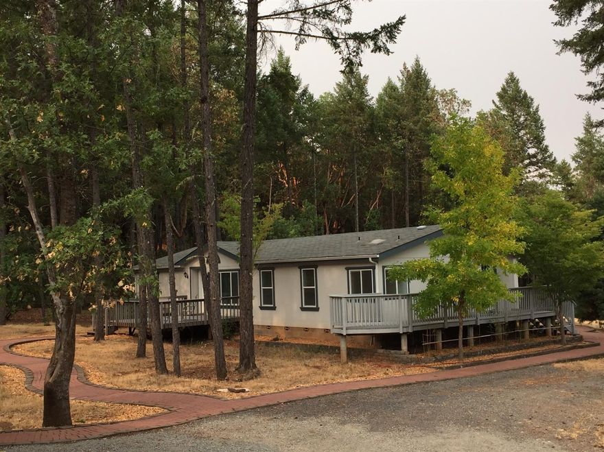 Secluded property boardered by Josphine County and BLM Land. 3 bed 2 bath with office or den. Open floor plan Master has walk in closet with soaker bath tub. Greenhouse with garden area. Lot next door is availiable 6 acres with well ( tested 10 gpm in 2016) with water rights in 2017. Buyer to do own due dilligence. All information deemed accurate but not guaranteed and subject to change at any time.