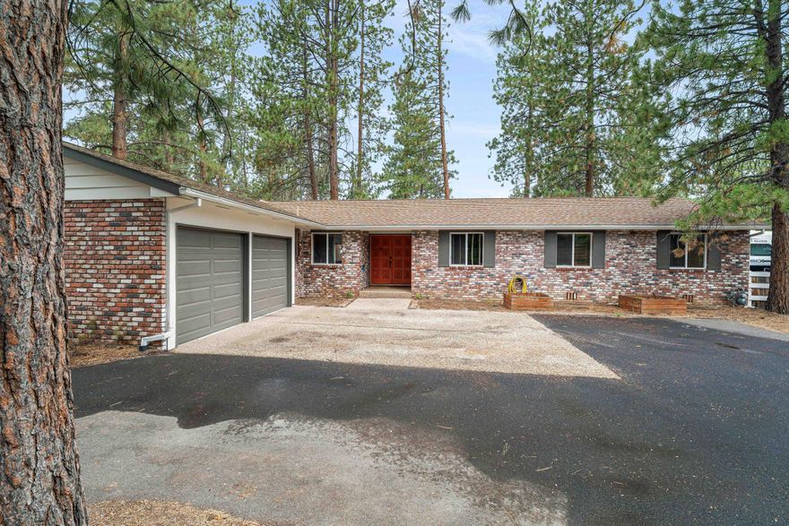 THE SELLER IS OFFERING A $5,000 CREDIT! Live the Bend lifestyle with space to stretch out! This well-appointed ranch-style home sits on over half an acre, offering the rare combination of privacy and proximity. Just minutes from Bend's best shopping, dining, medical services, and outdoor recreation, the location can't be beat. A brand-new neighborhood gem—Little Fawn Park—is also within easy walking distance, perfect for morning strolls, playtime, or picnics. Inside, enjoy 3 bedrooms, 2.5 bathrooms, a spacious living room, and a separate family room—perfect for relaxing or entertaining. The 18' x 24' shop adds incredible versatility for hobbies, storage, or creative projects. It's fully equipped with a 100-amp service, a 50-amp 240V receptacle, plumbing for air, and a dust collection system—ready for serious work or play. Outside, unwind on the back patio featuring a complete outdoor kitchen and a natural gas fire pit—ideal for entertaining year-round.
