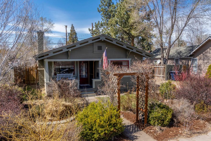 The porch complete with swing welcomes you to this well kept home.  Tasteful updates, hardwood floors, newer stainless steel appliances, gas range, gas fireplace. Lots of natural light.  Low-maintenance landscaping; 2 sheds, RV parking, off street parking, alley access to back yard.