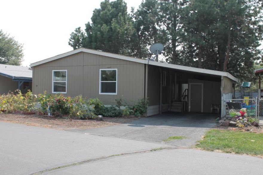 Nice double wide manufactured home in a family park. Clean with a lot of space. Carport and small storage shed.  Small fenced in back yard.   Park rent is $340 monthly. Park pays for garbage and snow plowing.