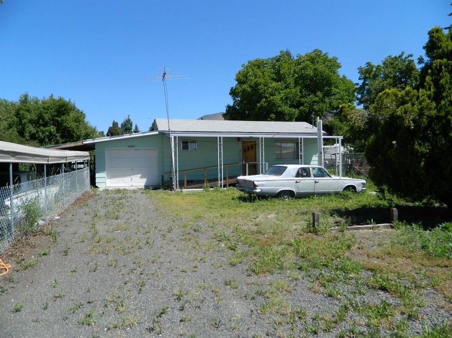 This studio style home sits on .42 acres with a single car attached garage along with an abundance of other covered storage. Property is fully fenced and has plenty of parking.