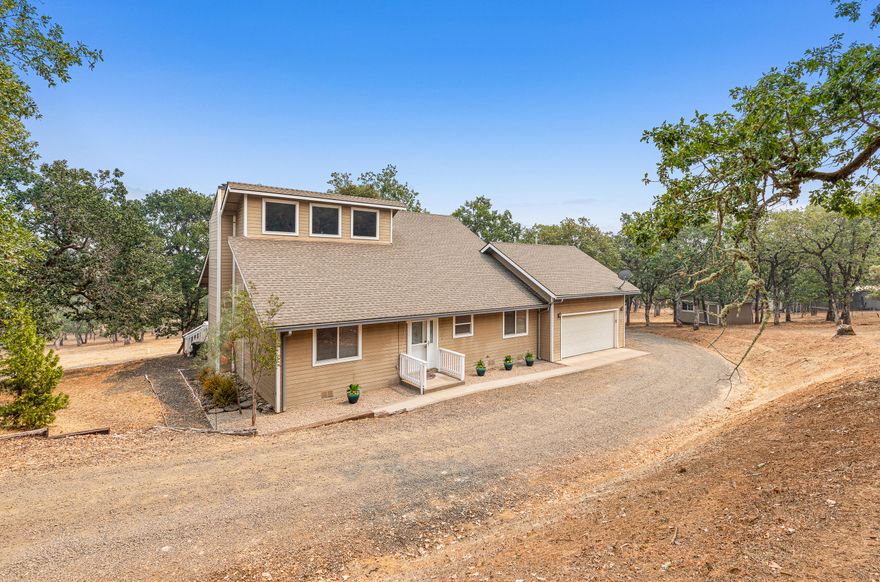 Rare and captivating 5.2 acres of private and quiet rural property less than 20 minutes from town.   When you step into this beautiful home you will be greeted with an open floor plan, a great room with 26' ceilings featuring a floor to ceiling river rock wood stove.  3 bed 2 ba home built in 1999 features new Samsung stainless steel refrigerator, washer, and dryer. Kitchen is granite and tile, has a built-in microwave, gas stove, and stained wood cabinets.  This home contains Alexa smart home features for the door, lights, music, and more. Second floor contains the master suite, bathroom, large walk-in closet and attic storage. The main floor has 2 good sized bedrooms, a laundry room and connects to the extra large two car garage. You will love spending your evenings on the large back deck watching the wildlife and taking in the mountain views. This property has a 24' X 40' RV Garage that has a large loft, 220/110 amp & water. Tour today!