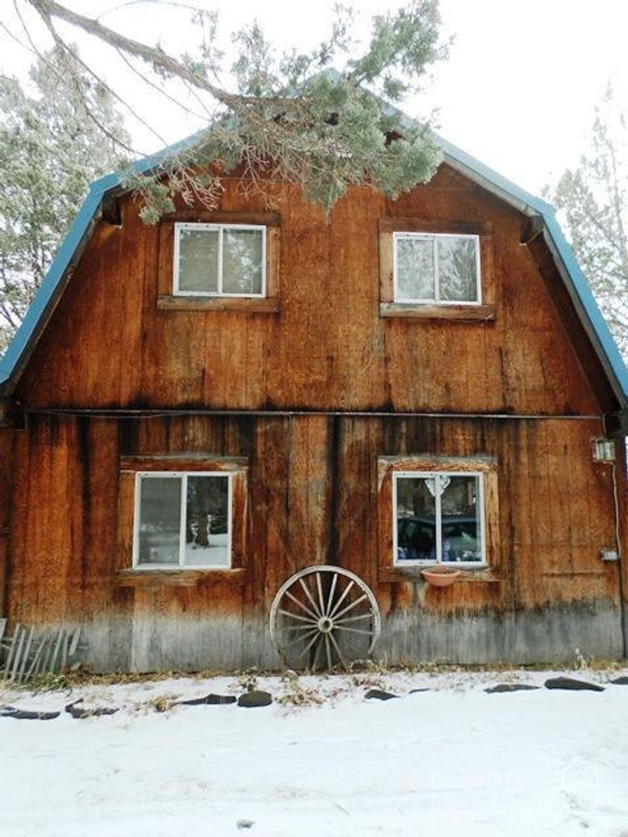 Located in Tumalo between Bend and Sisters. This 9.77 acre property has much to offer. The original 1978 stick built home is in need of work, but has charm potential. Remove or start over with a new home while living in this home. Utilities are in place, has original septic. Fenced and cross-fenced. 20'x30' detached shop with concrete floor, metal roof and power. Very private, lots of trees and peekaboo mountain views. Must have an appointment to view, no drivebys.