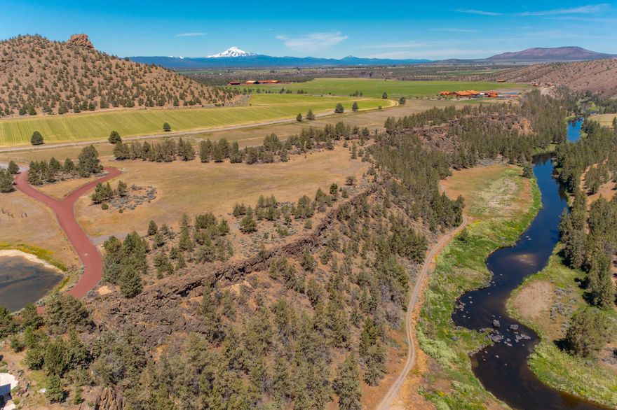 Perched on the rim of stunning Red Rock Canyon with sweeping views of Monkey Face, Crooked River, and Deer Island, this riverfront homesite is unique inside Central Oregon's coveted private community, The Ranch at the Canyons. Adjacent to the co-founder's homesite, this Landholding was recorded and purchased in 2007 as 10+ acres. In 2021, Deschutes County adjusted certain property calculations and although the Lot size remains exactly the same with the original building envelope, it is recorded differently at just under 4-acres. With only 46 homesites across 1,700 acres, ''Ranches'' provides serenity, exclusivity, and world class amenities, including horse stables, scenic trails, pool, event venues. Whether you're seeking adventure, relaxation, or a connection to nature, this exceptional property delivers it all within a setting that feels like a private national park. Experience where luxury meets the rugged beauty of the High Desert in this truly one-of-a-kind community.