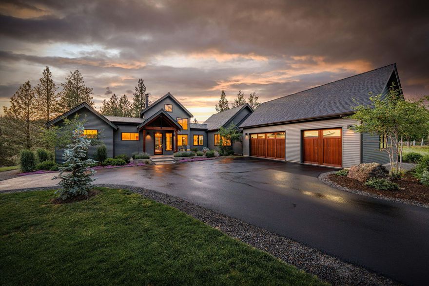 Discover this hidden gem nestled in the exclusive Awbrey Meadows subdivision, one of NW Bend's most desirable neighborhoods. This one of a kind custom built home sits on a private 1.03 Acre lot backing to serene forestry, a 3min walk to private river access on the Deschutes River and scenic trails out your front door. Tastefully designed with 24ft vaulted ceilings in the living room includes a stunning floor to ceiling steel wood burning fireplace. Expansive windows throughout captures all the natural light and the scenic private views behind the house. Thoughtfully designed kitchen features custom white oak cabinetry, a marble island, soapstone countertops, premium Miele Induction Range, and a seamlessly integrated built-in refrigerator. Luxurious Primary ensuite with radiant heated floors and zero entry showers in both bathrooms. Heated 3 Car garage and so much more. This is more than a home-it's a private sanctuary built for those who value design, nature, and effortless living.