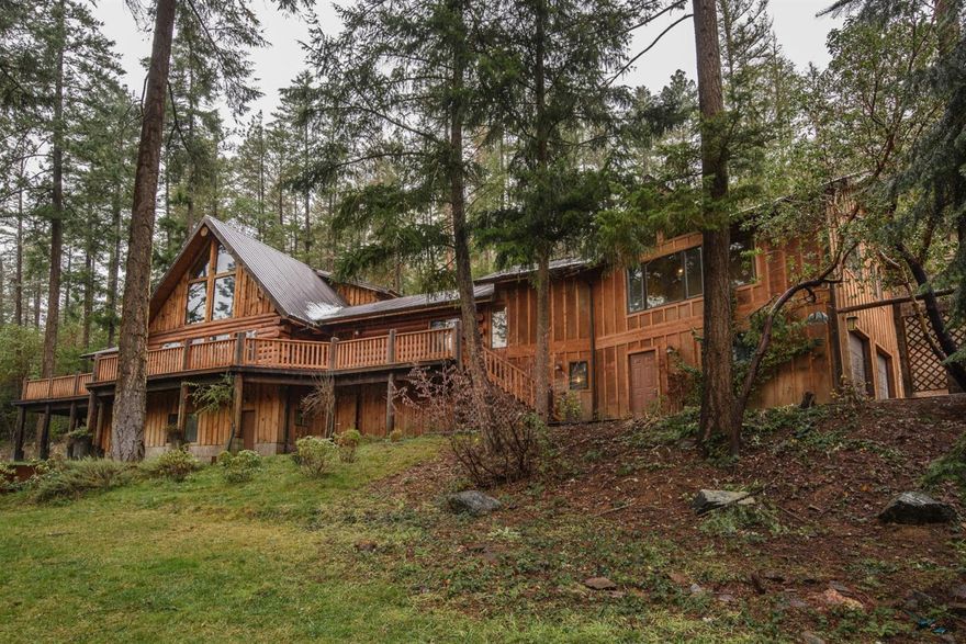 One of the best buys in So. Oregon(now under $134./ sq. ft.) Custom built log home with 8+ acres near the town of Applegate. Backs to BLM and has 45+ gpm well (when drilled) and new pres.tank. The soaring ceilings and river rock chimney give the 18x22 great room a wide open feeling. Huge wrap around deck is ideal for entertaining. The kitchen with Viking range and granite is a cooks dream. The loft area could be a bedroom or an office. There is also a 10x12 master closet and a 12x16 Man cave / craft room off the garage. 4 apple, 3 cherry, 2 pear, 2 plum, 1 apricot, 1 nectarine, 1 peach, 1 almond, 1 kiwi and 10 muscat grapes in orchard / 2 ac. deer fenced. Don't miss this wonderful country home. New engineered 3' retaining wall, french drain and landscaping underway. New log homes cost over $200. /sq. ft. to build. Custom entry gate has been added. $5000. for new carpet and paint of your choice credited in escrow. Pad for a green house or shop. Owner's are licensed brokers in OR.