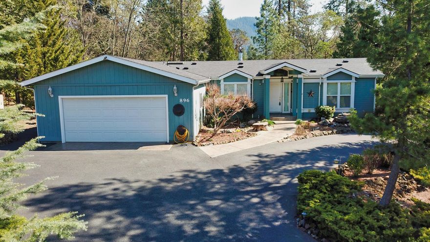 Colonial Valley Jewel on .83 landscaped lot.  3 bdrm 2 bath, 2494 sqft. Built in in 2003.  Vaulted ceilings, transom windows, light and bright.   Double Door entry, Living room with vaulted ceilings, wood burning fireplace, transom windows with delightful view of private backyard.  Kitchen features granite counters, center island, Oak cabinets.  Formal dining, family room.  Super spacious master bedroom with office attached, walk-in closet.  Master bathroom with dbl sinks, jetted tub and stall shower.  Oversized bedrooms.  Laundry room, double garage with built ins.  Covered deck, landscaped yard, fenced.  RV parking.