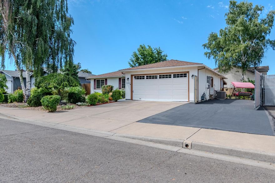 This wonderfully updated and immaculate 3-bedroom, 2-bathroom home sits on a nice .14-acre lot with secured RV/boat parking. The interior boasts an exceptional kitchen featuring granite countertops, stainless steel appliances, new faucets, and a convenient eating bar that flows seamlessly into the open family room. Amazing master suite with custom tile shower and bidet. The expansive backyard is perfect for entertaining, complete with a covered pergola and paved areas ideal for gatherings, gardening, or pets.  Both front and back yards have timed driplines for ease of watering. The seller's meticulous care is evident throughout this property, making it truly move-in ready for its next fortunate owners.