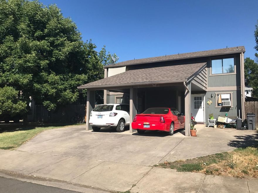 Zero lot line, townhome style property can be yours! Perfect for first time home buyer or investor. Close to shopping, schools, restaurants and churches. No HOA fees. 2 bed, 1.5 bath home with indoor laundry, private and fenced back yard, newer flooring throughout. Covered carport. End of the road privacy.