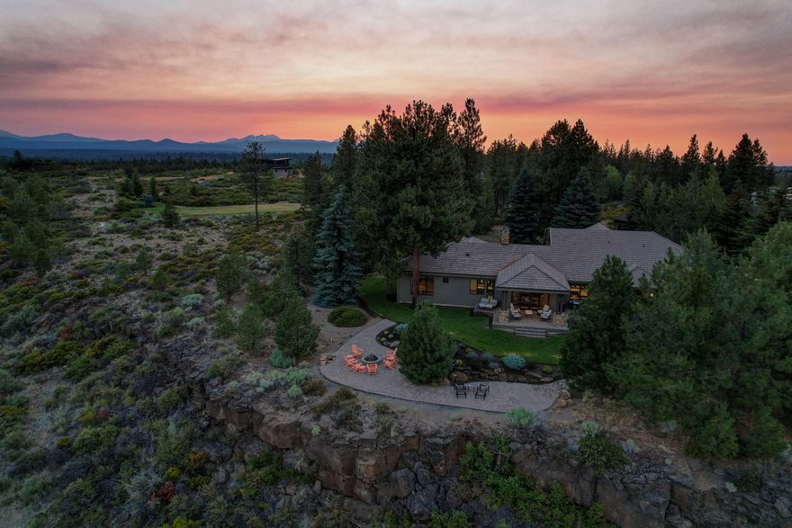 A coveted, one-of-a-kind property in Bend's close-in westside awaits you!  With deeded views of both the Deschutes River and Cascade mountains from this private 3.5 ac. park-like lot, this home is reserved for the most discerning of buyers. Comfort and sophistication meet in this NW contemporary designed home where the true 4-bedroom floor plan boasts two main-level primary suites, a separate office and bonus room, 2 additional bedrooms, and a masterfully designed chef's kitchen.  Entertain under an outdoor covered terrace off the dining area that flows to river-view patios with fire pit. A 1,300 sf detached three-bay garage provides space for toys and workshop. With double wall construction and fireproof exterior, this property sits toward the end of a long paved, private road in a neighborhood of high-end homes on small acreage. 18 miles to Mt. Bachelor and Cascade lakes, 4 miles to downtown, across from Tetherow and with direct access to trail systems. Open - Sat, 7/24 11 - 2 PM.