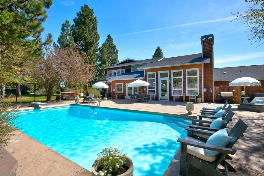 This country estate on 3.68 acres offers a private park like setting close to Bend. NW Style Custom Home is 4902 sq ft, 4 bedrooms, 4.5 bathrooms. Great Room with open floor plan, vaulted ceilings, wood stove, natural light. Gourmet Kitchen with SS high end appliances, Wolf 48-inch cooktop, double ovens, granite countertops breakfast nook. Formal dining room with wet bar. Two offices: one in the home, one attached to garage with exterior entrance. Upstairs master suite with fireplace, private balcony and down stairs bedroom suite with private bath. Bonus/Game Room, large utility room, 3 car attached garage with work bench, storage. Outdoor living is perfect for entertaining with a salt water pool, gazebo, hot tub, tree house and garden area. Yard is landscaped and pastures that have 2 acres water rights and a sprinkler system, fenced, gated, paved driveway, close to public land and can have livestock. This property is wonderful opportunity to enjoy any Central Oregon lifestyle!