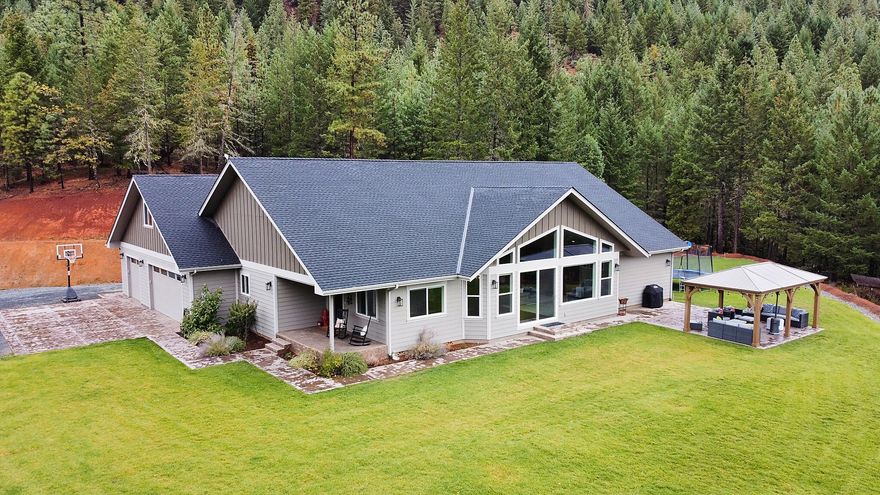 Gorgeous custom home boasting over 3300 sq. ft of living space, 5 bedrooms, 2 bathrooms all on 80 acres!  There is also a detached guest home.  Drive up this private gated wooded driveway and notice the abundant wildlife along the way.  The main home is open and natural light pours in.  Vaulted ceilings and amazing views from every window.  The chef's dream kitchen has  quartzite counters, huge farmhouse sink, gas stove and a huge pantry.  Notice the high end finishes throughout the entire home.  The huge great room has cool/warm tones together.  The master bedroom has 2 large walk in closets, claw tub, steam and double headed shower.  The other bedrooms are very spacious.  The bathrooms all have leathered granite counter tops.  There is a huge bonus room upstairs that has separate heating/air.  Outside you will find a huge yard, views, gazebo and hiking trails backing to BLM.  There is also a 1288 guest home that is just as beautiful featuring 2 bedrooms/1 full bathroom.