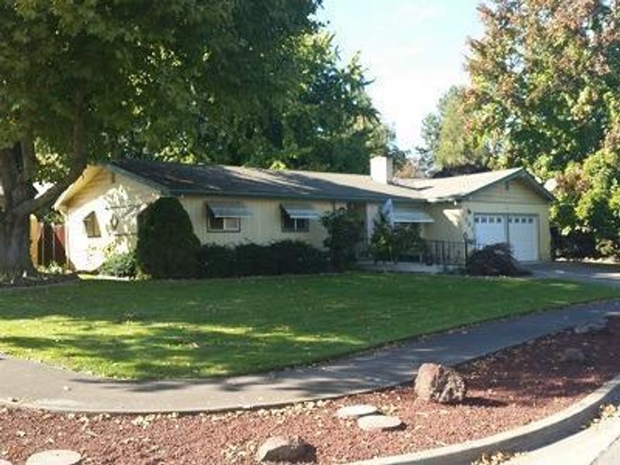 Very nice 1307 square foot, 3 bedroom, 1.5 bath home in the Blossom Hill Terrace subdivision. Very quiet and low traffic area of East Medford, yet close to shopping, hospital, schools, and many other services. Interior features living room with fireplace, comfortable kitchen and both the living room and master bedroom access large covered patio. Much of the interior of the home including flooring, paint, appliances, plumbing fixtures, HVAC system, and more have been upgraded during the last 2 years. Most appliances and window coverings are included. The home sits on almost a quarter acre corner lot, with fenced back yard, in-ground sprinkler system, mature landscaping, and good size RV parking. Home is a great fit for just about anyone. It won't last long, so call for your tour today!