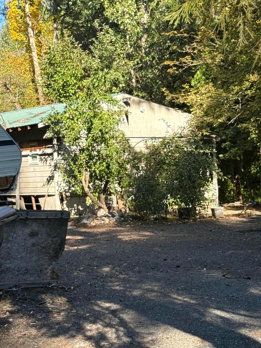 .70 acre lot with functioning well and septic system. A creek borders the back of the property. providing a natural setting. Existing structures and current items will remain and are included in the sale. Value is in the land.

Property is being sold as is. Buyer to perform all due diligence regarding condition, utilities and intended use.