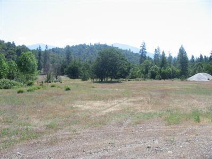 Located halfway between Murphy & Williams on the sunny side of the valley. Over 8 acres of level usable land backed by BLM. 32 gpm well when drilled. 1000 gal. standard septic installed in 1993. Build your dream home.