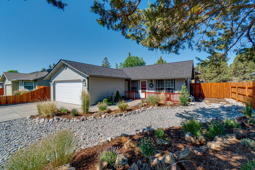 Immaculate home w/ desirable curb appeal that will serve as your own private oasis located in the heart of Bend, min from Pilot Butte, Pine Nursery Park & The Forum Shopping Center. Covered front porch leads into the vaulted great room plan that boasts laminate flooring throughout all main living areas plus a cozy gas stove fireplace. Kitchen ftrs quartz counters adorned by full height designer backsplash, central island, double oven, & eating area w/sliding glass doors that leads out back to the patio. Primary bedroom is located at the end of the hall w/ private bath & step in shower. Two other bedrooms share a full bath w/ shower/tub combo. Out back you'll find everything you need for a relaxing evening or an afternoon of entertaining. Multiple patio areas, raised garden bed, grilling area, serene corner water feature. Fully landscaped & fenced w/ sprinklers in front & rear. 1 yr old roof, new front gutters. Don't miss this opportunity to live and play in the heart of Central Oregon.