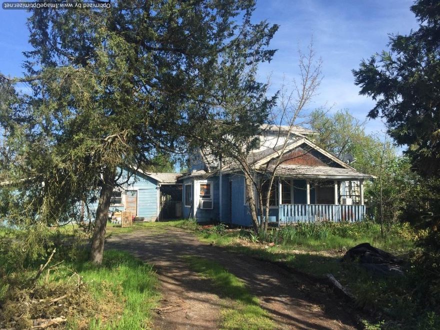 This property is nearly a half acre, adjacent to two new subdivisions. It could make a great development opportunity, or the home could be a re-hab project to build some sweat equity. The home is livable,but could use extensive repair and updating. This is a cash sale. Buyer to do all due diligence regarding development and connection to city services.