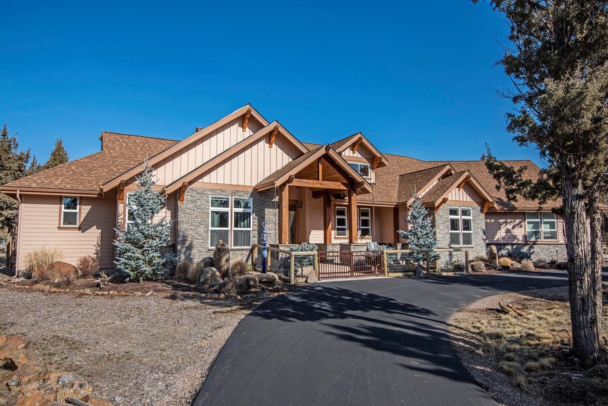 Custom Pacific Northwest-style single-level home on 2.5 acres in Squaw Creek Canyon Estates, Sisters, Oregon. Thoughtful 2,910 SF open floor plan has a great room gathering area with two wings, one for owners and one for guests. 3 total bedrooms + office space (or 4th bedroom) & 3 full baths. The gourmet kitchen has an island & breakfast bar, 2 prep areas, a walk-in pantry, plus high-end stainless-steel appliances including a 48'' 6-burner Dacor double-oven, 48'' Samsung smart fridge, and 2-drawer bar fridge. The master suite has double vanities, a walk-in shower, linen cupboards, a walk-in closet, and an attached laundry area. Wood burning fireplace plus a heat pump for heating & cooling. The 3-car extended garage has an easy-on-your-back versa lift to the attic. A fully fenced backyard has a covered outdoor living area with stub for propane BBQ. Outdoor buildings including a heated/cooled workshop, woodshed & greenhouse.