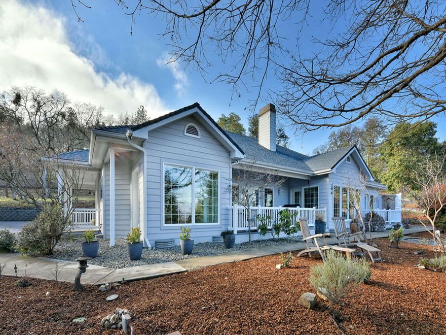 Peaceful country living in the SW hills of Medford. One-level floor plan with brilliant light streaming in thru the view windows and French doors leading to the outdoor porches. Huge chef's island kitchen with quartz counters, sunny breakfast nook, eating bar and adjoining family living center. The owners set this home up with 2 bedrooms, office/den with 2 built-in desks & a library with custom-built floor-to-ceiling wooden bookcases. These spaces can easily be converted into bedrooms 3 & 4. Other flexible living spaces include a formal parlor with cast iron gas fireplace with an adjoining radiant sun room & a formal dining room with built-ins for your fine collections. Enjoy the huge master bedroom suite with jetted tub & separate shower. The finished 2-car garage plus an 8 x 19 storage/shop contains a 300-gal storage tank, UV water sterilizer and a softener/filter system. All this just a short drive to historic Jacksonville & convenient Medford shopping & medical services.