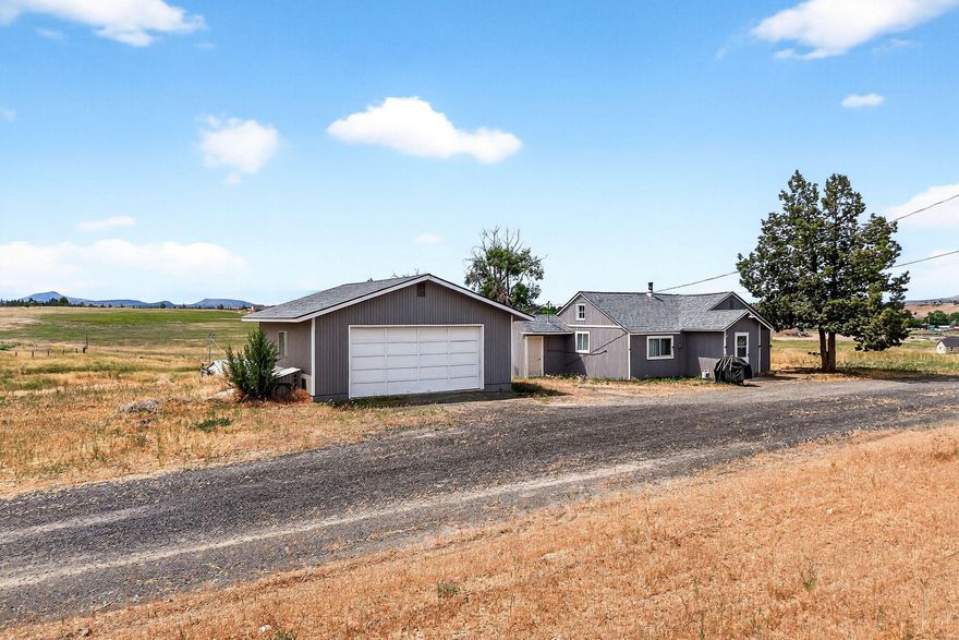 This property has interesting possibilities. It could be a convenient horse property, a place to build one's dream home, or a place to simply hold for the long term. The two bedroom, one bath home has been a good rental for the current owners. The double car garage is also a plus.