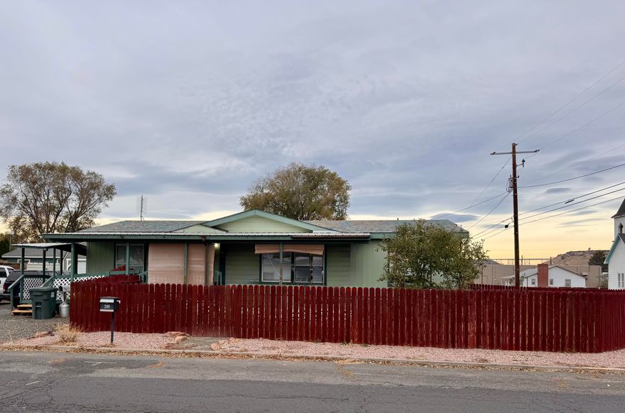 This spacious 3 bedroom, 2 bath home offers the perfect balance of comfort and potential. Just a block from local schools, it provides everyday convenience while still enjoying the peace of a quiet neighborhood. Step inside to a generous open living room with vaulted ceilings, creating a bright and airy atmosphere. The home is equipped with forced-air heating and cooling for year round comfort. Outside, the oversized driveway offers plenty of room for RV parking and all your outdoor toys. With solid bones and timeless design, this property is ready for your personal touch, an incredible opportunity to create the home of your dreams.