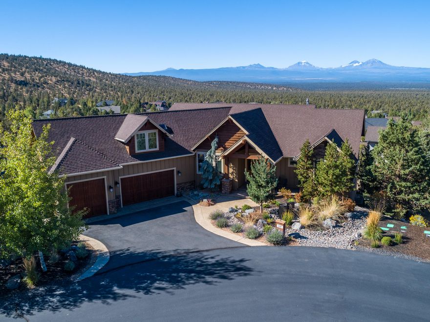 Gorgeous Custom Built Home perfectly situated to capture the Breath taking Cascade Mtn views from the moment you walk in the front door. The Great room floor plan has vaulted ceilings, gas fireplace with stone surround, hearth and built in's, this is sure to be where guests and family members gather. Home features include Russian Birch hardwood floors, solid core doors, wood wrapped windows, impressive Gourmet kitchen with top of the line appliances, honed granite slab counters, designated dining room, owners suite on the main level, walk in closets, extensive tile work, double decks with those Westerly view off the back side of the home which can be seen from all of the main living areas.  The upper level bonus room is great for extra beds or turn it into your dream game room.  The cozy lower level TV room is a great separate space with 2 additional huge bedrooms and bathrooms. Call to schedule your showing today!