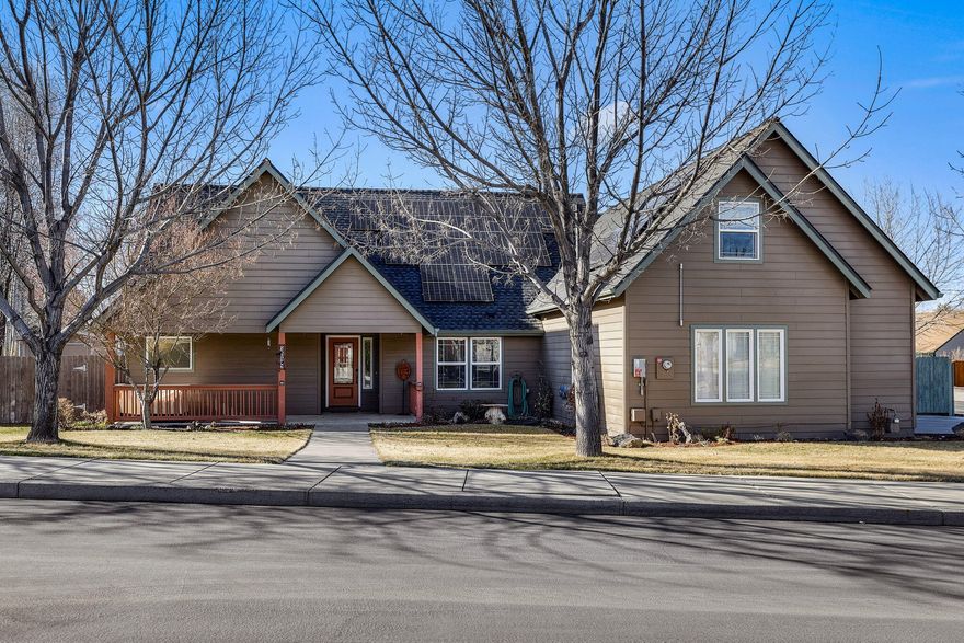 This thoughtfully-designed home, around the corner from Dry Canyon trails, offers dual suites at opposite ends of the home, ideal for multigenerational living or guests. One suite includes an upstairs bonus room for music or media, hobbies, or kids play area. Between suites is a versatile bedroom/office, making the layout adaptable to your lifestyle. Whether you are hosting family, work from home or just need space, this layout offers endless possibilities. The room separation creates privacy zones, while the open concept living area keeps everyone connected. Main living area is light & bright w/vaulted ceilings, engineered wood flooring & gas FP. The updated kitchen includes slab granite, soft close cabinets, SS appliances, solar tubes, farm sink, & pantry. Fenced back yard, UG sprinklers, covered deck, pergola, 2 sheds, RV area & mature landscaping. New roof & solar panels installed in 2022.  Come fall in love w/this home which is designed for flexibility, comfort & modern living!