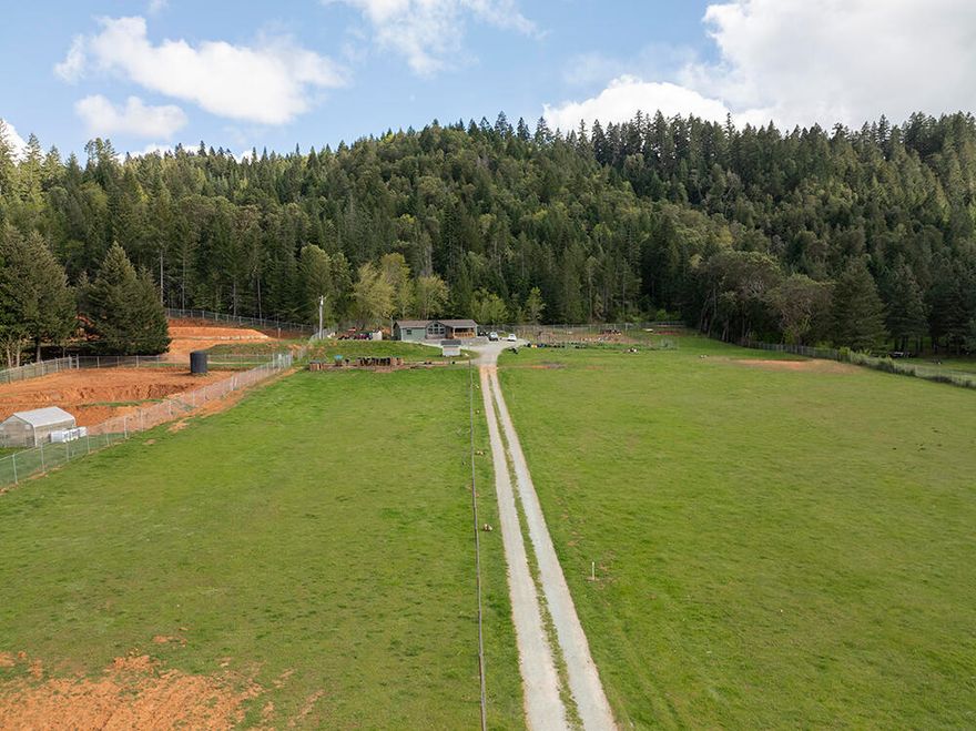 Tucked away in Beautiful Southern Oregon, is a prime 13.64 Acres, backed by BLM.  If you have been looking to live off the land, grow your own food, and raise some animals, while also live in a newer home, this affordable opportunity is IT!!!  Welcome to this 2020 built, 1494 sq ft, Manufactured 3 Bed/2 Bath Home!  It has Vaulted Ceilings and an Open Living Design, creating a spacious Living Area.  The Kitchen has Ample Cabinetry & Countertops and includes a Breakfast Bar.  All three Bedrooms have Walk-In Closets.  The Laundry Room also serves as a mud room, off of the back porch and includes a utility sink for all of those farm chores!  Outside, there is a year-round spring, a seasonal pond, a seasonal creek, fenced & crossed fenced animal pens, & a garden area.  Riparian rights are also included for irrigation.  Don't let this one get away!  Schedule your tour today!  (See 321 N Frontage Rd also for sale, adjacent to this property)