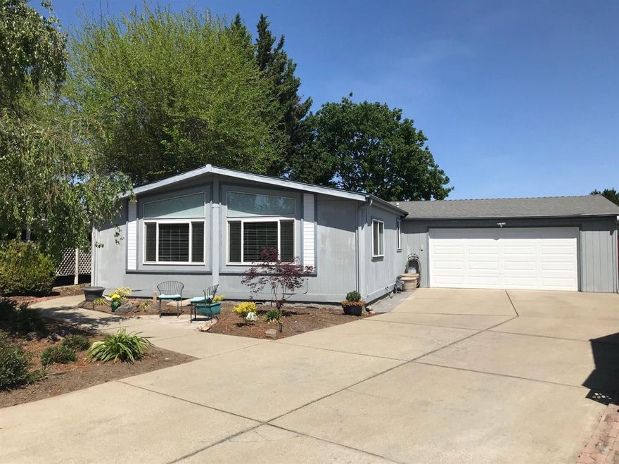 This wonderful home in the Meadows, a 55+ community. It has been recently updated with a new kitchen and gorgeous backyard! The home is light & bright with lots of windows. 3 bedrooms, 2 baths, living room, family room and laundry room! The beautiful kitchen has new cabinets, countertops and floors. The recently finished back yard has a covered patio, a sunny brick paver patio, nice grass area and a peaceful water feature. There is a 2 car attached garage and a driveway large enough for extra parking or to park your RV while you load up for your next adventure. Some of the community amenities that the HOAs cover are the clubhouse, hot tub, pool, exercise room, billiards, walking trails, exercise room and trash service. RV storage is available for a fee.