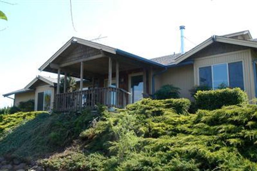 Super investment or two family set-up. Main house is 3 bedroom/2 baths with 2 car garage. Good condition with views and private setting. Separate cottage is 2 bedroom and 1.5 baths, 824 sq ft. Units are set back off N. Main. Private and quiet.