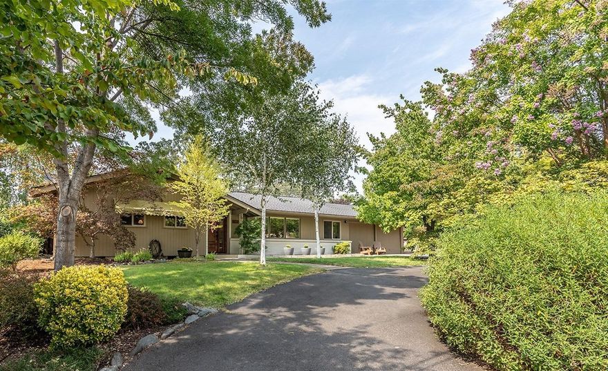 Charming, single level rambler in a fantastic, sought after, East Medford neighborhood. 4 bed, 3 bath, 2179 sq. ft. on a .36-acre lot featuring beautiful modern updates with traditional appeal. Hardwood floors throughout, 2 large living spaces, updated bathrooms with tile floors and contemporary fixtures, arched doorways and a large open dining area. Convenient kitchen with expansive island and eating bar, granite countertops, gas cooktop, ss appliances and an oversized sliding glass door leading to the backyard patio. Huge, 2-tiered backyard with plenty of room for a pool, a large patio, storage shed and a 432 sq ft shop with a glass roll up door. Endless possibilities as a shop or ADU. Mature landscaping, in-ground sprinkler system, circular drive and RV parking. Hoover Elementary, South Medford High School area AND within walking distance to schools, shopping and medical facilities!