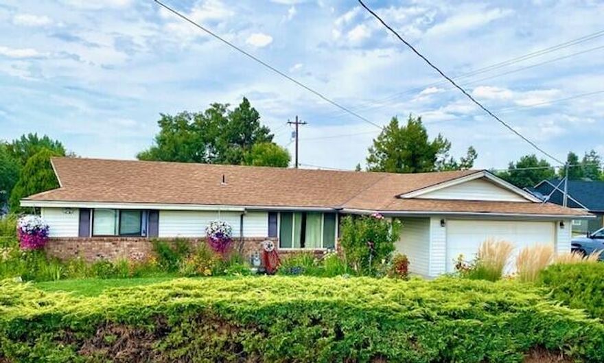 ROOM FOR EVERYTHING! 
This property sits at a convenient location in town and is a little over a quarter acre, extra parking for your RV, boat or trailers.  Large open floor plan, beautiful wood floors, remodeled bathrooms, brand new back yard deck, 2 large sheds, room for gardening, the list goes on and on, this one will be gone soon.