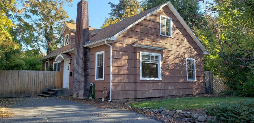 Multiple opportunities with this two story, 1680 square foot, 3 bedroom, 1 bath property with a full basement. Classic built in bookshelves and cabinets along with the mid century hardwood floors. 2 bedrooms and bath on main level and large bedroom/family room upstairs.