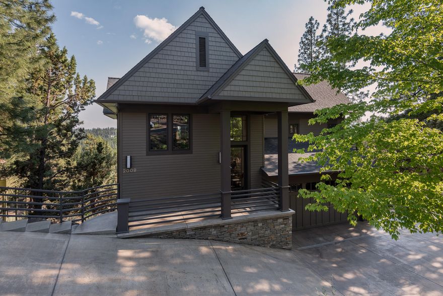 Experience the breathtaking beauty of this serene treetop retreat. With its modern design and artistic vision, this home exudes a sense of tranquility. This home has been meticulously reworked by local designers, resulting in exceptional finishes and features that include solid fir wood wrapped metal windows and doors, Hubbardton Forge lighting, and a stunning blend of hardwood, heated tile, and cork flooring. Delight in the pleasures of the exclusive sauna waiting for you on the lower deck, offering a customized space to unwind and rejuvenate. With three bedrooms, two and a half baths, an office/den, and a separate 198 square foot artist's studio (not included in home square footage), this property has everything you need. Nestled on a .31-acre lot, the property boasts metal-framed, coated concrete patios that allow you to soak in grandeur views of Mount Bachelor and the city. Come experience the perfect blend of luxury living and natural beauty.