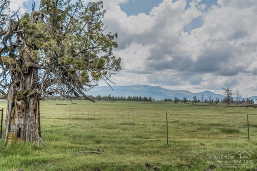 Bring the kids & 4-H animals, be a farmer or just enjoy the wide open spaces on prime Powell Butte property, 39 acres w/38 acres of flood irrigated water for easier maintenance. Enjoy some Cascade Mtn & Smith Rock views from the property. Old west-style 6-stall barn, 1-foaling stall, tack room & hay loft on wooden floors. Stock pond near the barn for multiple uses. Plenty of room for toys, equipment, RV's. This is your chance for country living! Hard to find, ready to go with lots of potential!