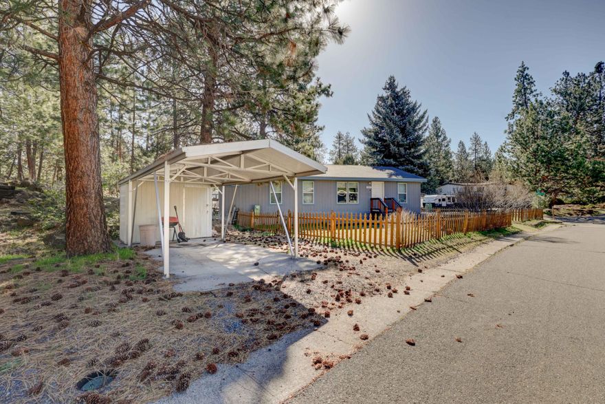Cute, newer double-wide manufactured home in Southwest Bend. This home sits in a quiet, peaceful, treed area of Romaine Village. Come check out this terrific home - minutes from the the Old Mill, restaurants, trails, the Deschutes River, and all Central Oregon has to offer. Sold AS-IS. Sale includes mobile home only - no land. Monthly space rent of $925.00 includes water, sewer, garbage, and seasonal yard debris pickup, as well as the use of the community clubhouse & newly renovated pool area. A fenced RV storage yard is available at no extra charge to residents (as space allows). Romaine Village requires potential buyers to submit an application at their office to prior to making an offer.