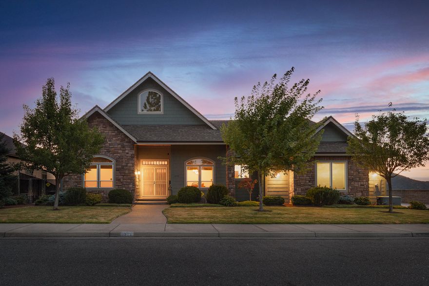 Prestigious custom-built home sits on top of NW Starlite, delivering stunning views of Grants Pass below! Built by Randy Hagerman in 2007, it offers over 3300sqft & 3 master suites. The tiled entry greets you w/ 10ft ceilings that lead to a light & bright living area highlighted by custom built-ins & spectacular views of the city.  An open kitchen w/ granite countertops, pull-outs in every cabinet, a walk-in pantry, a wet bar area & door that leads to the wrap-around deck, perfect for entertaining or enjoying your morning coffee. The main floor master features a large walk-in closet & ensuite bath complete w/ soaking tub & shower. Downstairs is a common area w/ wet bar, 2 bedrooms w/ their own ensuite baths & walk-in closets! Don't forget the spacious driveway & an oversized 3 car finished garage that offers endless storage & space for toys.
