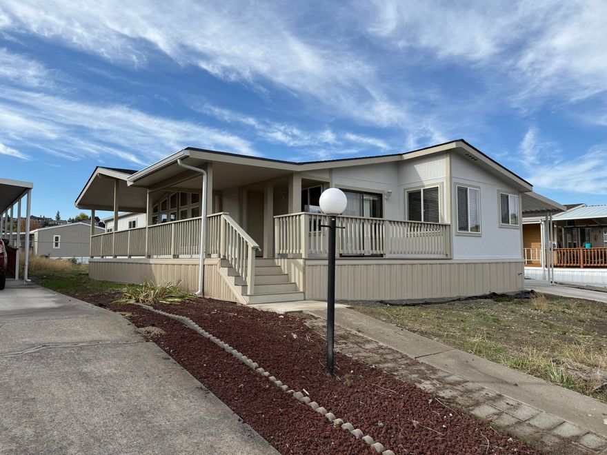 Very nice home, just moved to Greenway village 55+ park, with one of the lowest park rents in the valley! Vaulted Ceilings in living room, kitchen and primary bedroom. New roof, New windows, new covered deck, new skirting, new paint inside and out.  Land lease includes garbage, water & sewer.