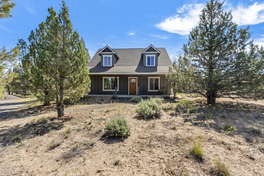 Live, adventure, & play in the heart of Central Oregon on 1.9 acres w/3 bed + 2 bath home!  Vaulted living area w/wooden beam accents, slate flooring, a gorgeous slate surround gas burning fireplace & an abundance of light throughout! Open kitchen ftrs granite counters, plenty of counter & cabinet space, a large breakfast bar island w/ storage, under cabinet lighting, stainless steel appliances, gas range, & a large eating area! Large vaulted primary bedroom also ftrs wooden ceiling accents, ceiling fan, plenty of windows, granite counters in bath, w/ step in shower. Two additional guest bedrooms share a full bath. Loft area overlooks the downstairs and offers plenty of space for small office or tv/media area as it currently is used. Covered front & back patios, firepit, RV parking w/dump & hookups, shop, & plenty of privacy! An additional 1.86 acre lot is for sale next door if you're looking for more room, both taxlots can be sold together! Call for details!