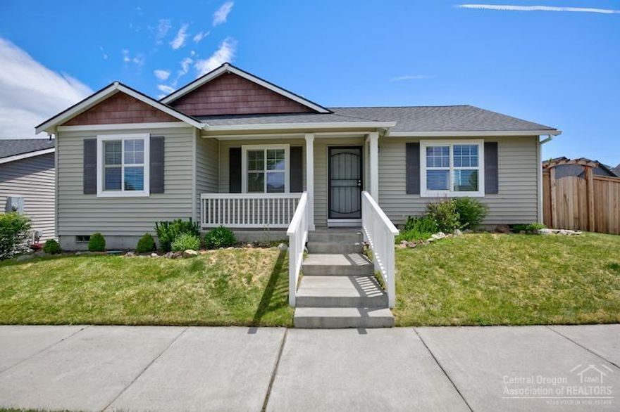 Lovely home on corner lot with large fenced, beautifully landscaped backyard.This home offers Pergo wood flooring throughout, tons of natural light, a gourmet kitchen with slab granite counter and stainless steel appliances, including the refrigerator. Vaulted ceilings, over sized two-car garage, cedar HEART fence, and within close proximity to the new Empire Crossing restaurants and market. This home is located in a quiet neighborhood with peaking views of the Cascade Mountain Range.