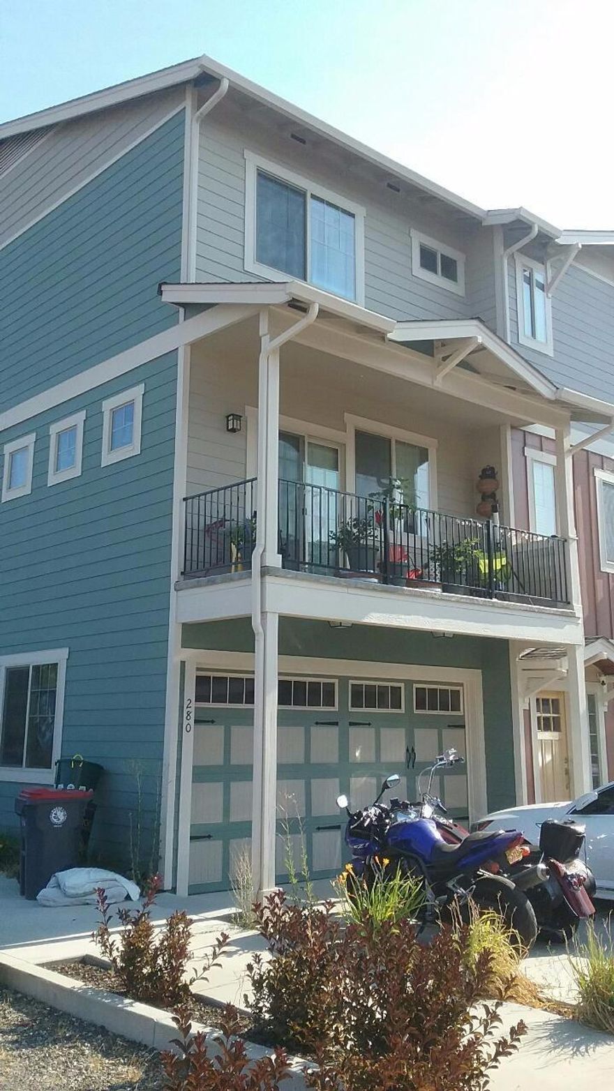 Well cared for end unit townhouse located between Medford and Jacksonville. 3 bedroom/3 bath home with 9 ft. ceilings. Great location, excellent floor plan. The living room, dining room, and kitchen is on the mid-level. Amenities include stainless steel appliances (including fridge), granite counter tops in kitchen, newer washer and dryer, tons of storage, and covered balcony off the living room. Top level features a large master suite with dual vanity sinks, his and her walk-in closet, nice sized guest bedroom and closet, another bath, and laundry. This floor plan is one of the few in the development with a wider two-car garage door. Great backyard space! Oak Grove Estates also includes a basketball court and community yard area.