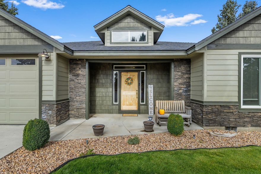 Stunning Single level home on 5 private acres! ! This gorgeous 1,700+ sq ft home lives larger than expected with its open-concept design and cozy propane fireplace. The primary suite offers direct access to the hot tub for evening relaxation, while the backyard invites fun and connection with a stacked fireplace, tranquil water feature, and a large above-ground pool with deck. Bring your hobbies, pets, and projects—there's a 30x30 shop, dog run, and plenty of room to spread out. Plus, a 2020, 1,000 sq ft manufactured home with a hardship permit adds flexibility and opportunity. A true lifestyle property built for comfort and enjoyment!