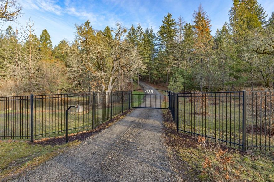 Privacy in the Country! Hard to find 4 bed/2 bath 1782 SF manufactured home on 4.6 flat usable acres! Park-like setting w/year around spring fed pond, fully fenced property with security gated entry! Move-in Ready with a ton of updates in the last 2.5 years! Updated Kitchen w/granite counters, new skylight, SS appliances and a large walk-in pantry. New Blaze King wood stove and ceiling fan in the living room. Newer flooring and Brand new window blinds throughout! Master suite has a large walk-in closet and a spacious master bath. New tub and surround in the hall bathroom. New well- larger pressure tank and well lines to the pump house. New decks, exterior paint and gutters! Beautiful new driveway in and up to the house! Detached 24x36 garage/workshop, outbuildings for livestock and plenty of parking for toys and RV's.