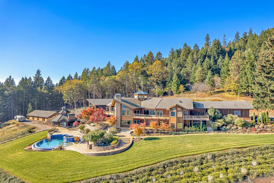 Welcome to Sky Ranch, a 12,000'+ multi-family estate on 83 acres, nestled in the beautiful Cascade Mountains of Southern Oregon. Back on market at no fault of property. The sweeping private drive reveals the formidable 10,199' mountain lodge, custom-built by Robert Repine, the original 1920's farm/guesthouse (approx. 2,500'), and the 3,600' detached shop/garage.  Inside the main home, you are welcomed by a Giant Bird of Paradise plant that the home is built around. On the main level, you will find a spacious living room with a bar, two built-in dens, a chef's kitchen, and the 2,300'+. primary suite complete with an en-suite office, two bathrooms, and a sauna. Downstairs, there are 3 additional bedrooms, a recreation room, and movie theatre. Stepping outside, there are extensive stone walkways surrounded by professional landscaping that will take you down to the pool, hot tub, and large poolside bar, with two full bathrooms/locker rooms below. Please find extended remarks attached.
