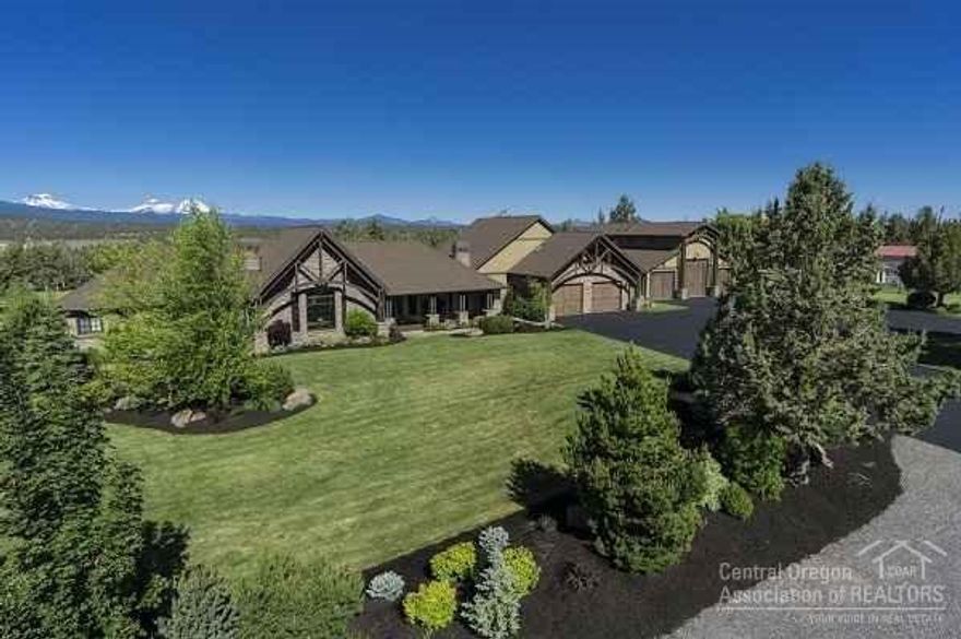 Amazing 6 acre Tumalo estate! Just minutes to Bend, this custom built home offers 4 bedrooms, 3.5 baths on the main plus a bonus room/half bath up. The great room is a masterpiece with old world beams, re-claimed wood floors and a cultured stone fireplace. The well designed chef's kitchen is perfect for entertaining large groups or a cozy family meal in front of the fireplace. The heated three bay shop has room for an RV, boat and all your toys. All this plus a 1bd/1.5bath apt and more!