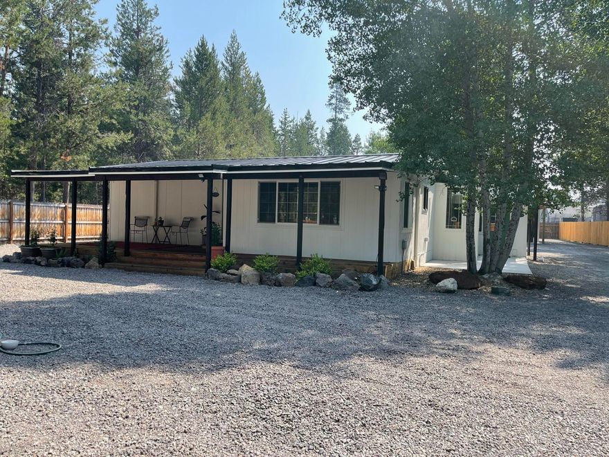 You're going to love this charming 1975 Manufactured Home in Three Rivers.  Nestled on a spacious 0.49-acre lot, this home offers a prime location just minutes from the Deschutes River and a private marina. All appliances are included.  Some of the key Features include two Mitsubishi Mini splits, instant hot water heater, a cozy wood stove, and a fire pit ensure comfort year-round, plus a 22x47 shop with an enclosed room perfect for storage or a gym.  There's also a wood box behind the shop.  The small outbuilding is ideal for an office. Option to include a house warranty and two 20-ft storage containers available for purchase.  Note: This property cannot be financed through conventional means.  Although cash is preferred, financing options are available.  Call for the preferred lender's contact info.